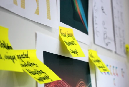 Post-it notes on the wall in a strategy workshop